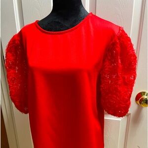 Adorable red top with floral puff sleeves